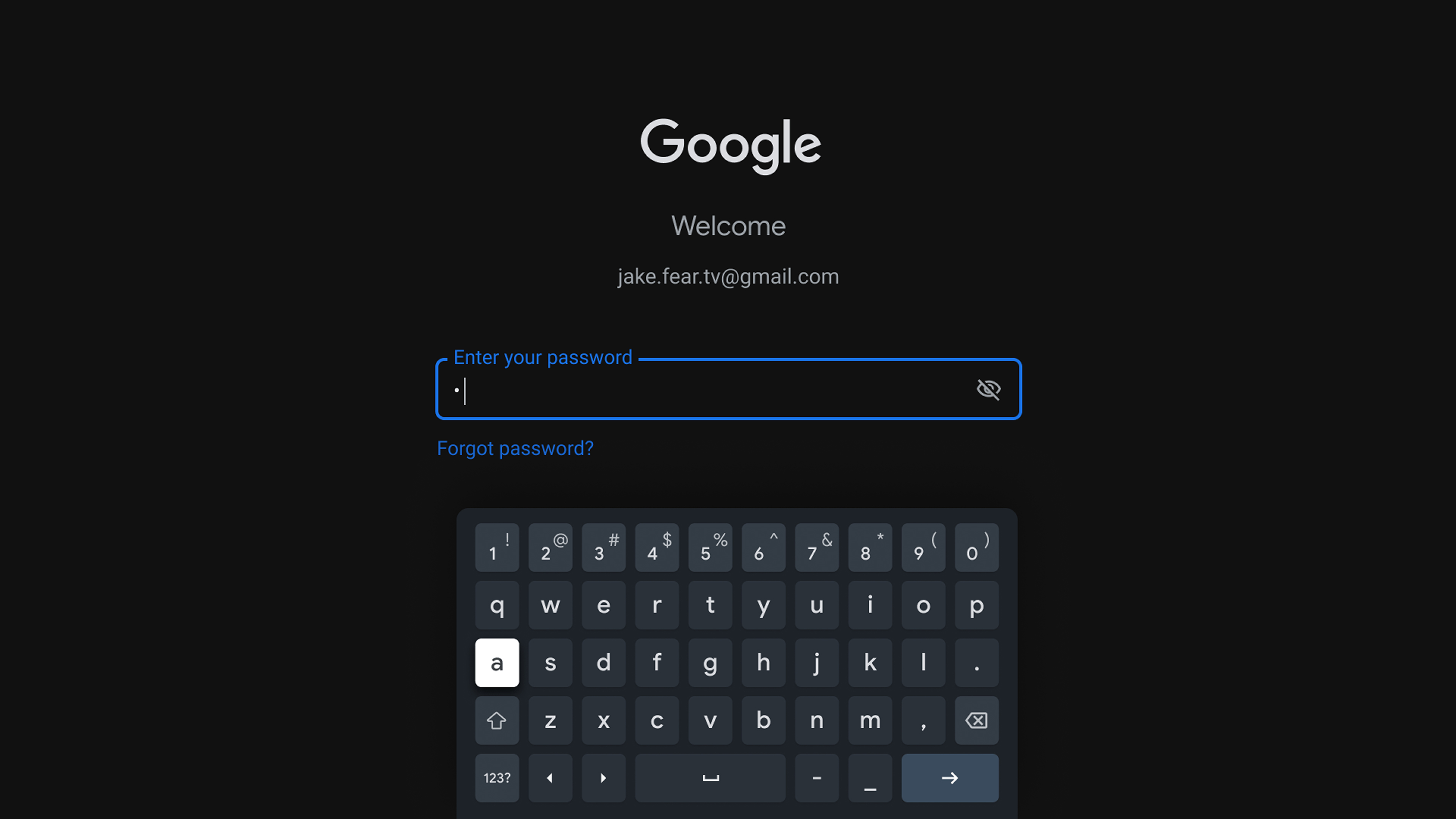 A modern on-screen dark-themed keyboard interface from Google's GBoard for Android TVs. The top of the screen is reserved for user details, with focus on the password field. Below the password field, a virtual keyboard with a QWERTY layout is visible, featuring rounded keys with white lettering on a dark background.