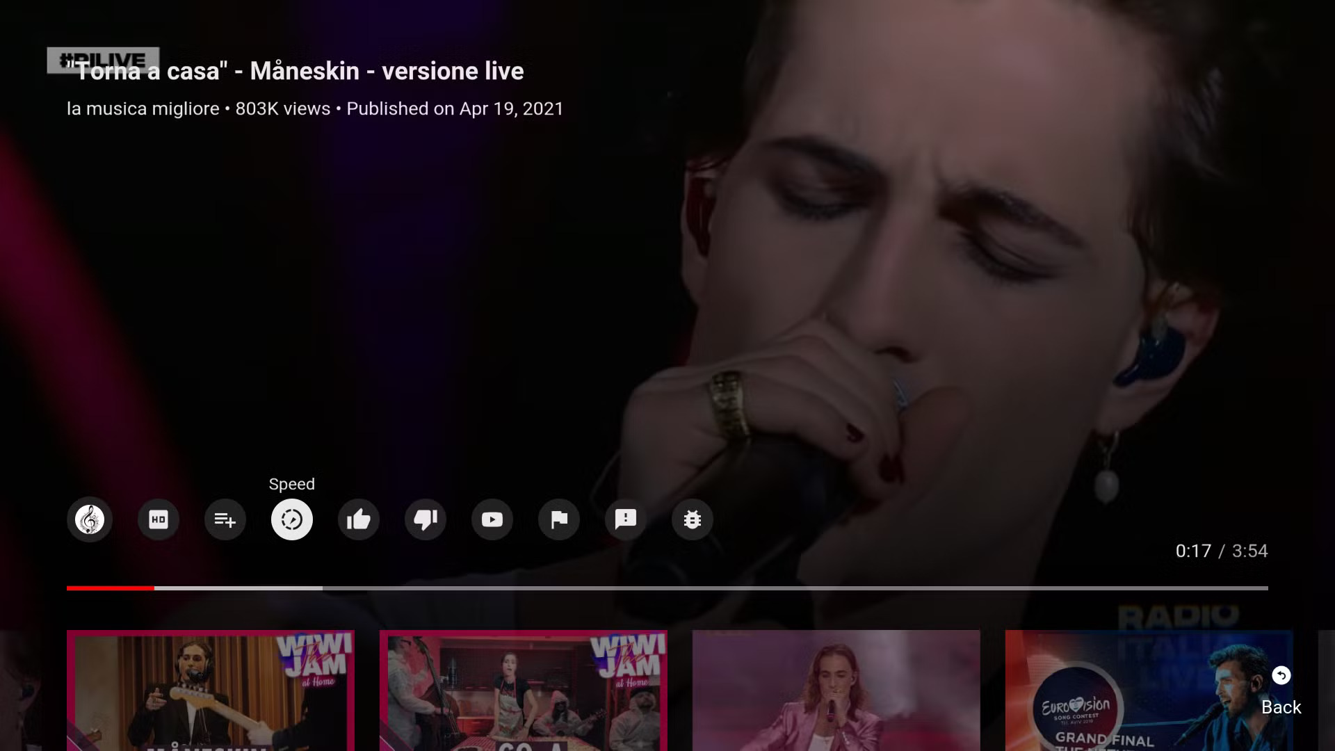 YouTube TV player interface during video playback, displaying a range of controls including playback speed, quality, like/dislike, and related video thumbnails. This showcases the app’s extensive in-player functionality.