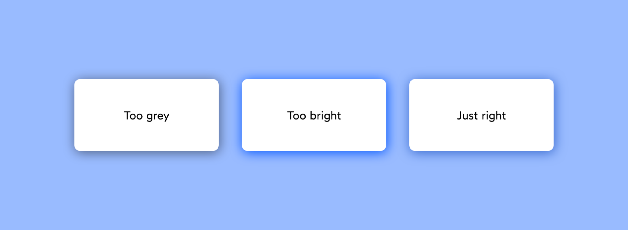 A screenshot of three white rectangles on a blue background, one with a grey shadow labeled 'Too grey', one with a bright blue shadow labeled 'Too bright', and one with a subtle blue shadow labeled ‘Just right’